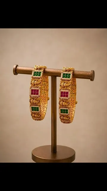 Pair of kundan bangles on a stand